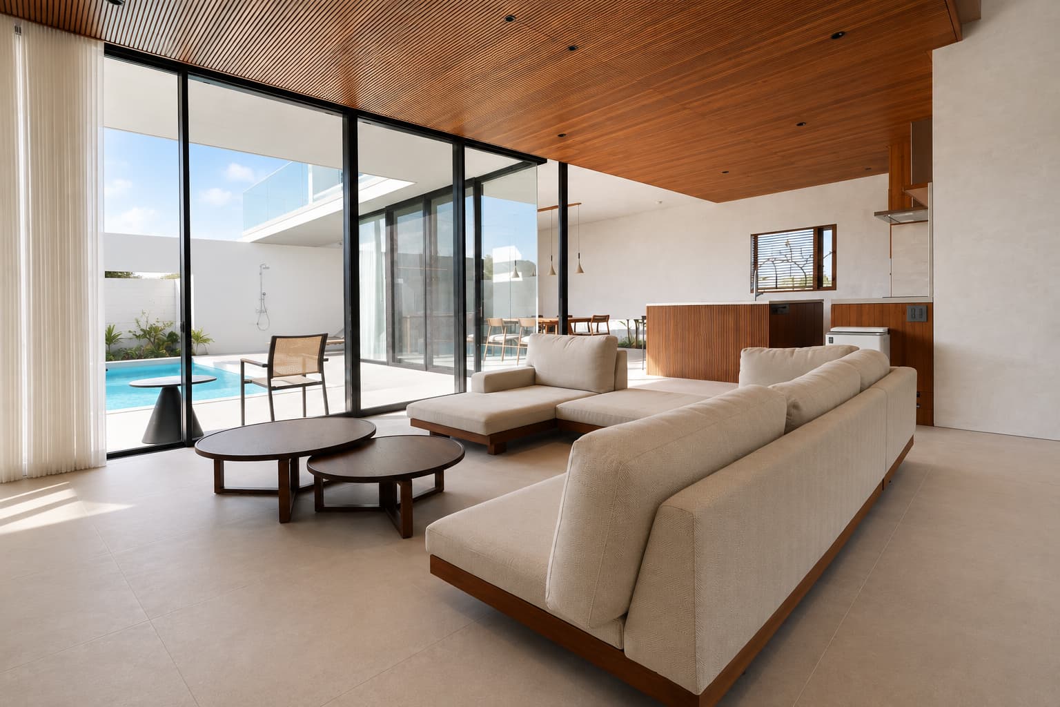 The living room opening out toward the pool